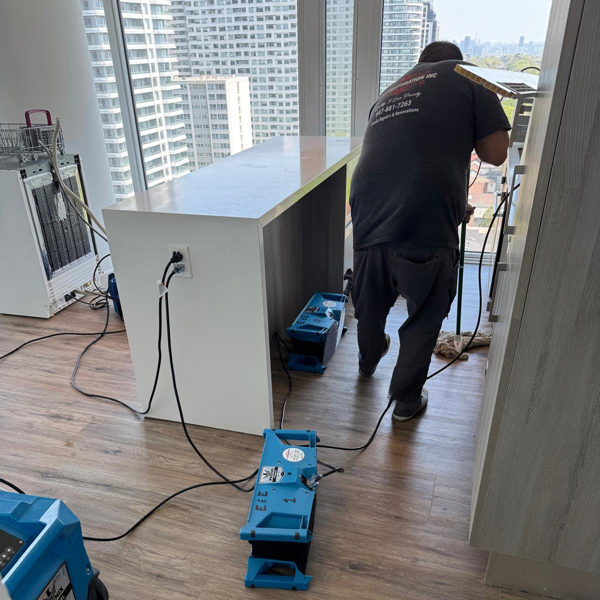 E& E Restorations cleaning up the damage caused by a leak